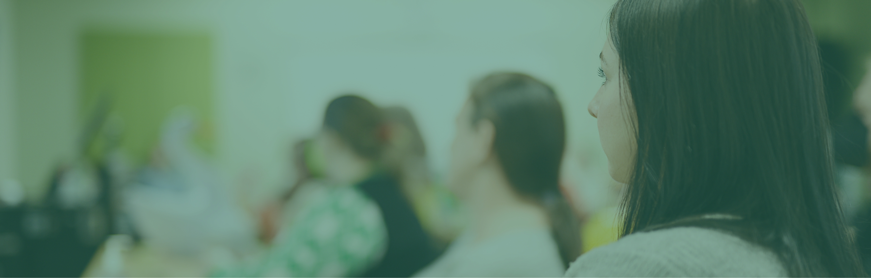 young woman looking forward in a classroom environment